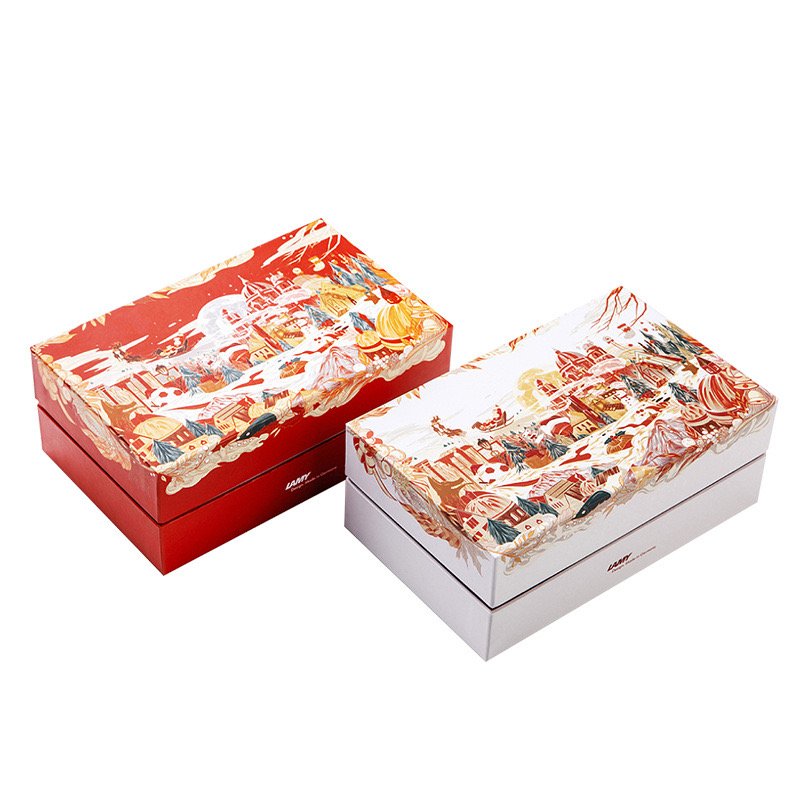 Two colorful festive gift boxes with detailed holiday-themed illustrations.