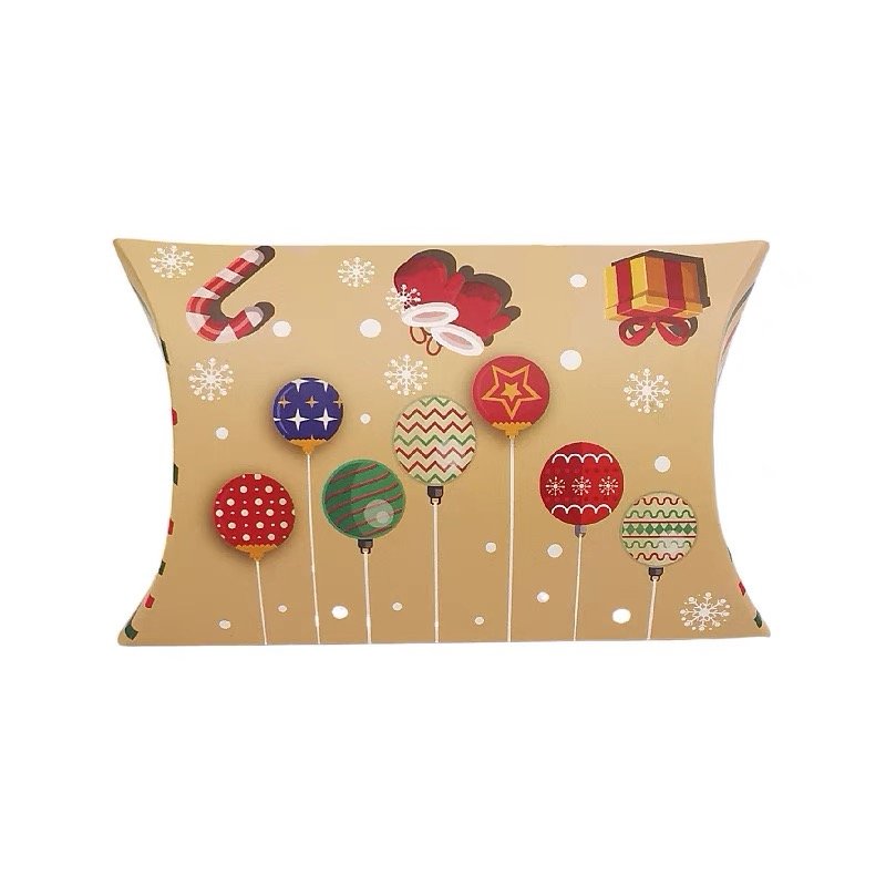 Gold pillow box with colorful holiday-themed designs and ornaments.