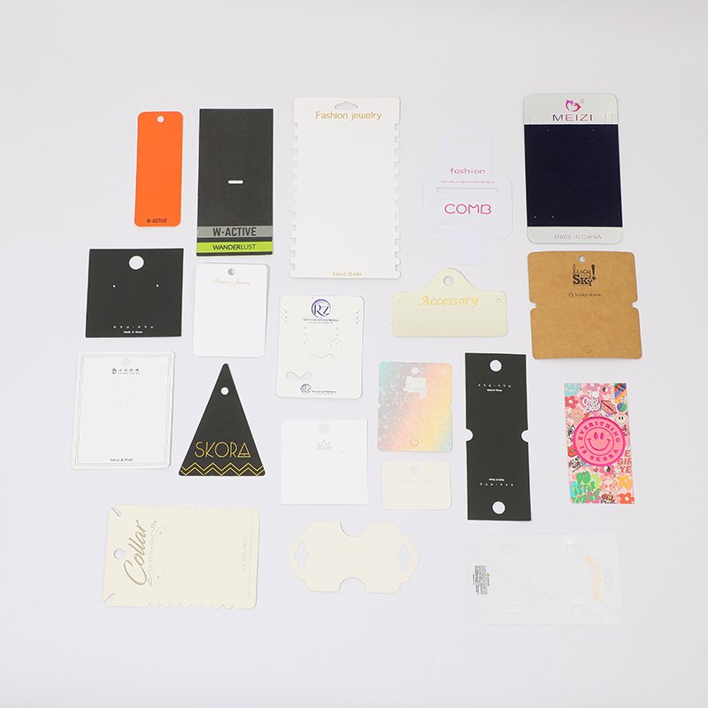 A collection of various fashion and product tags displayed on a white surface.